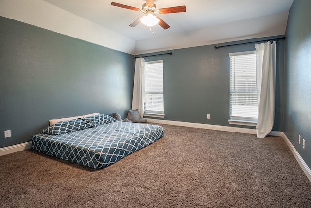 bedroom with ceiling fan and carpet floors