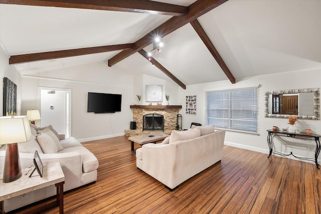 living room featuring vaulted ceiling with beams, a fireplace, and hardwood / wood-style flooring