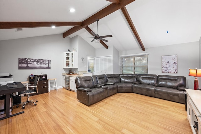 living room with beverage cooler, ceiling fan, beam ceiling, high vaulted ceiling, and light hardwood / wood-style floors