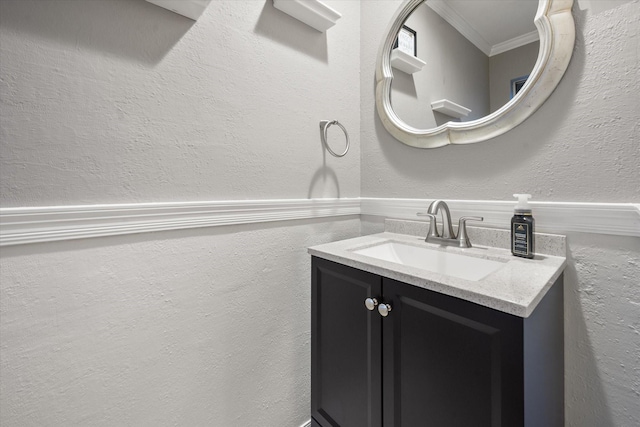 bathroom featuring vanity and ornamental molding