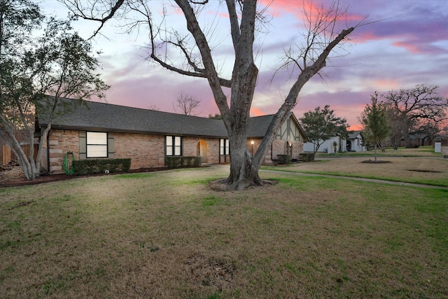 view of front of home with a yard