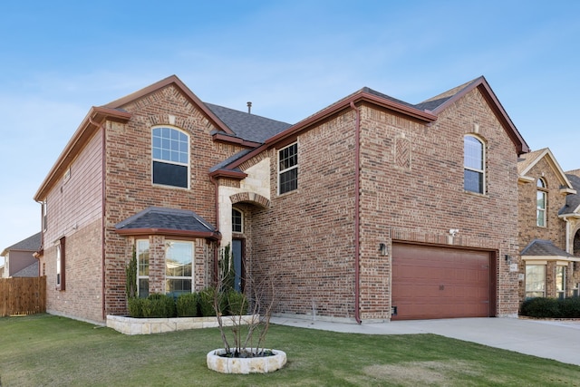 view of property with a garage and a front lawn