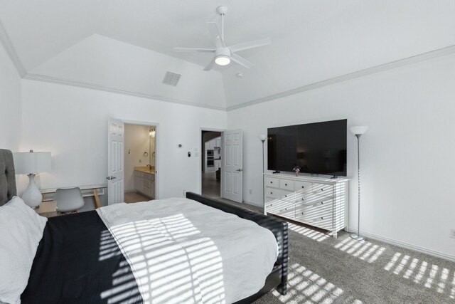 bedroom with carpet flooring, ornamental molding, vaulted ceiling, ceiling fan, and connected bathroom