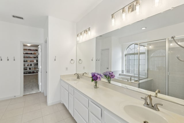 bathroom with vanity, tile patterned floors, and an enclosed shower