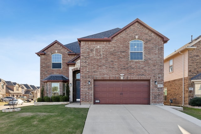 view of front property with a front lawn and a garage