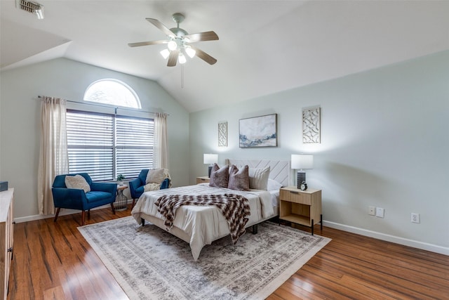 bedroom featuring ceiling fan, dark hardwood / wood-style floors, and vaulted ceiling