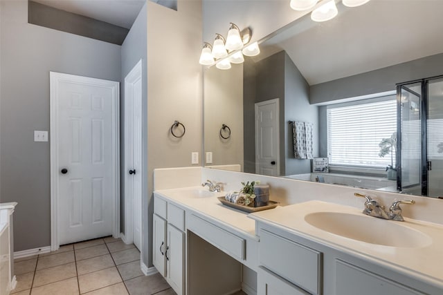 bathroom with tile patterned flooring, vanity, and separate shower and tub