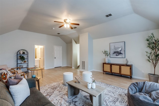 living room featuring light hardwood / wood-style flooring, vaulted ceiling, and ceiling fan