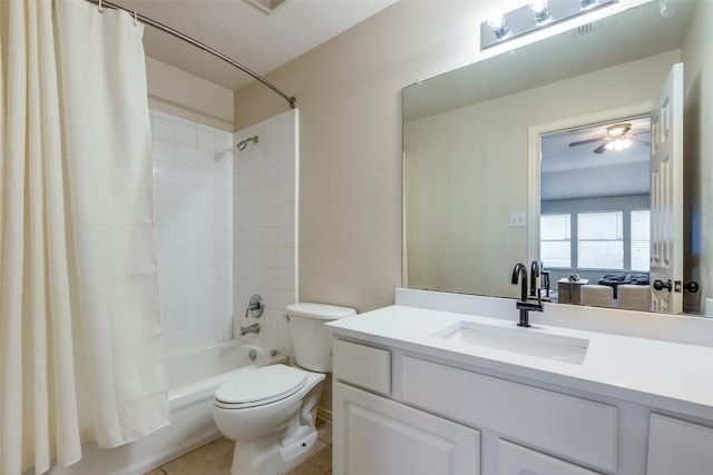 full bathroom featuring ceiling fan, tile patterned flooring, toilet, vanity, and shower / tub combo