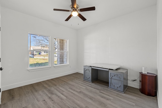 office area featuring light hardwood / wood-style flooring and ceiling fan