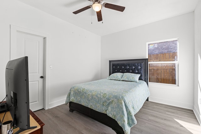 bedroom featuring ceiling fan and hardwood / wood-style flooring