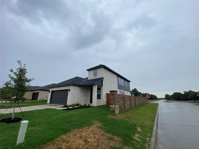 view of property exterior featuring a garage and a yard