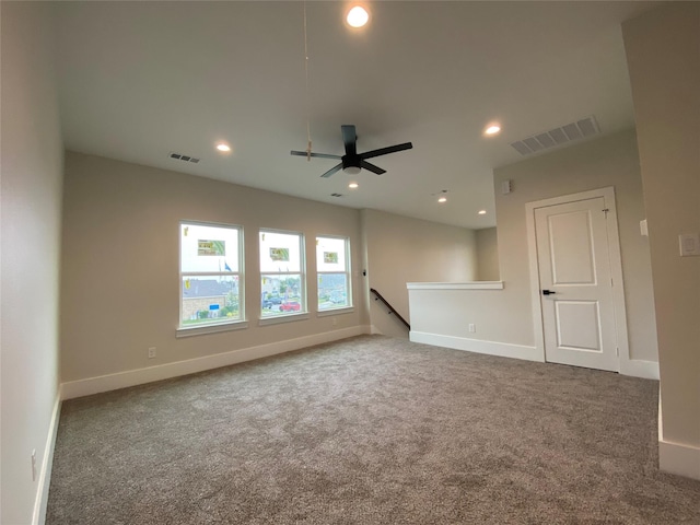 carpeted empty room with ceiling fan