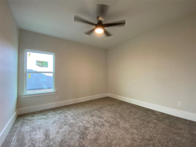 carpeted empty room with ceiling fan