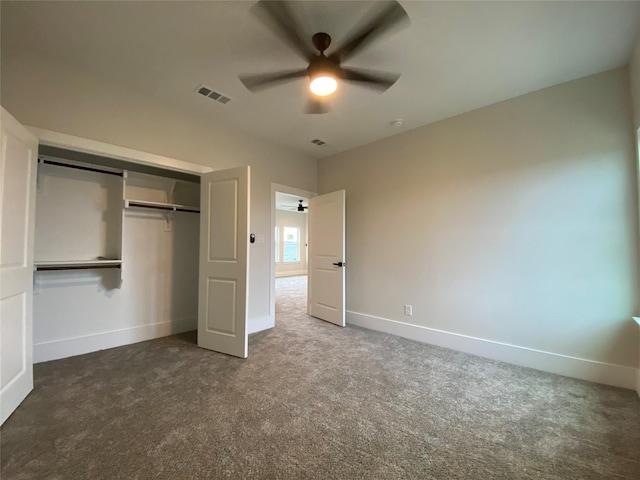 unfurnished bedroom featuring a closet, ceiling fan, and dark colored carpet