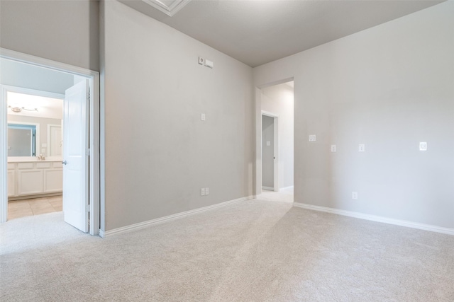 empty room featuring light carpet