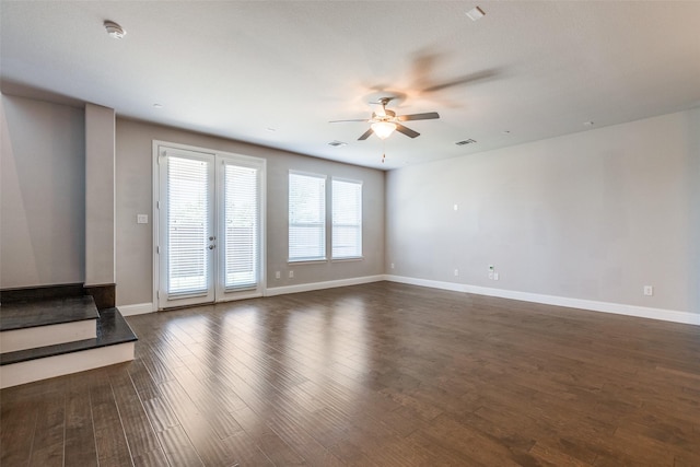 unfurnished living room with ceiling fan, french doors, and dark hardwood / wood-style floors