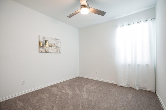 empty room featuring ceiling fan and carpet flooring