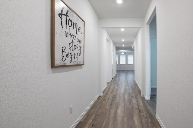 hall with hardwood / wood-style flooring