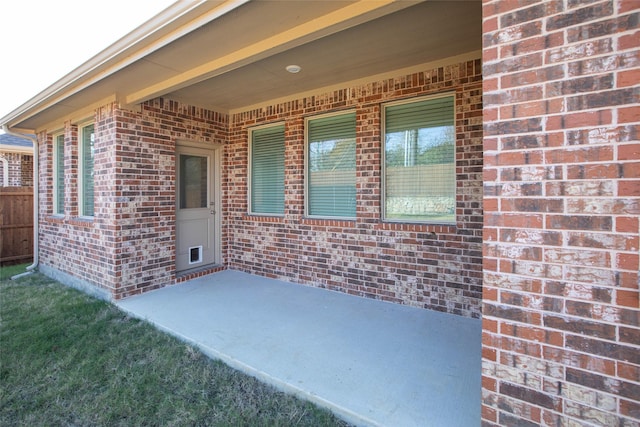 property entrance featuring a patio area