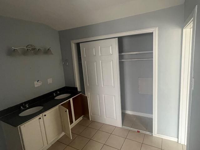 bathroom with vanity and tile patterned floors