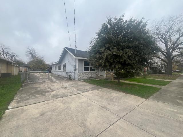 view of side of property featuring a yard