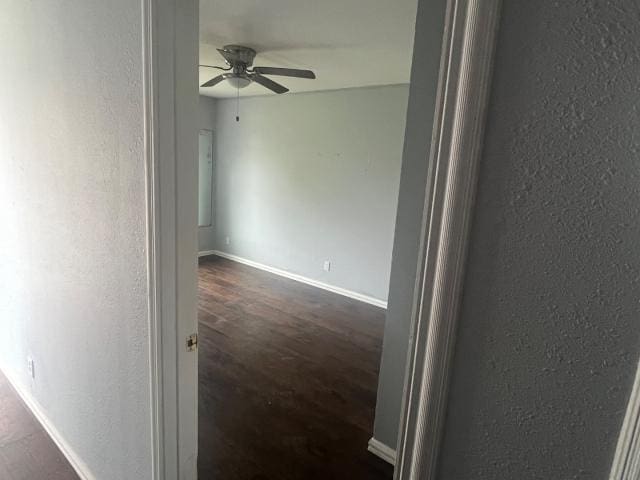 hallway with dark wood-type flooring