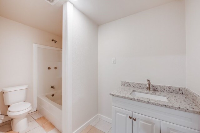 bathroom featuring vanity, toilet, and tile patterned flooring