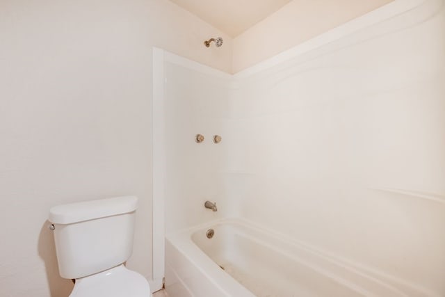 bathroom featuring bathing tub / shower combination and toilet