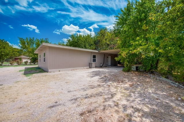 rear view of house with a carport