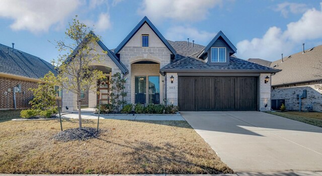 view of front of property with a garage