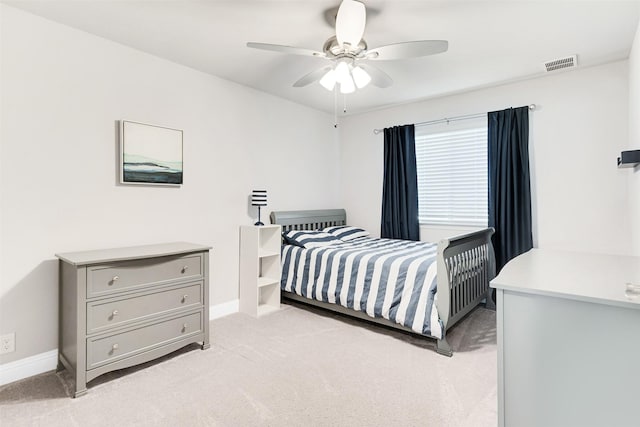 bedroom with light colored carpet and ceiling fan