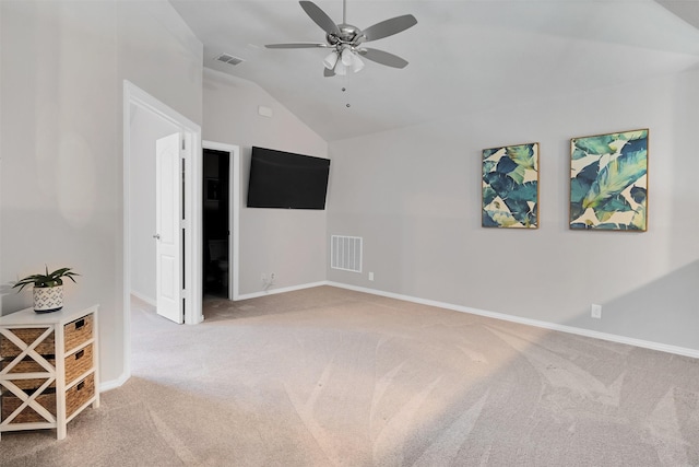 carpeted empty room with ceiling fan and lofted ceiling