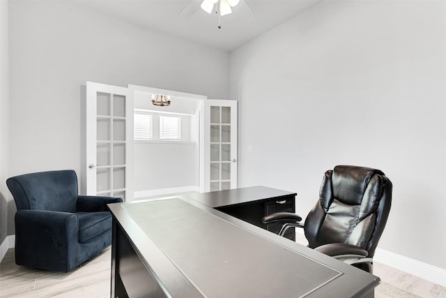 office space with ceiling fan, french doors, and light hardwood / wood-style flooring