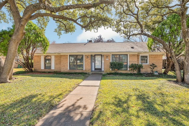 single story home featuring a front yard