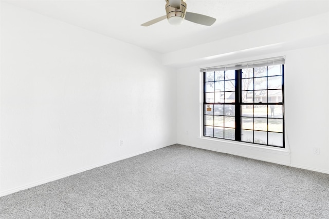 unfurnished room featuring carpet and ceiling fan