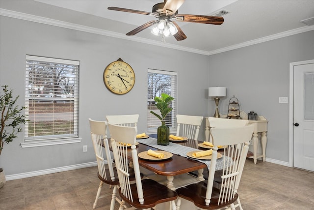 dining room with ornamental molding and ceiling fan