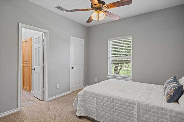 carpeted bedroom featuring ceiling fan