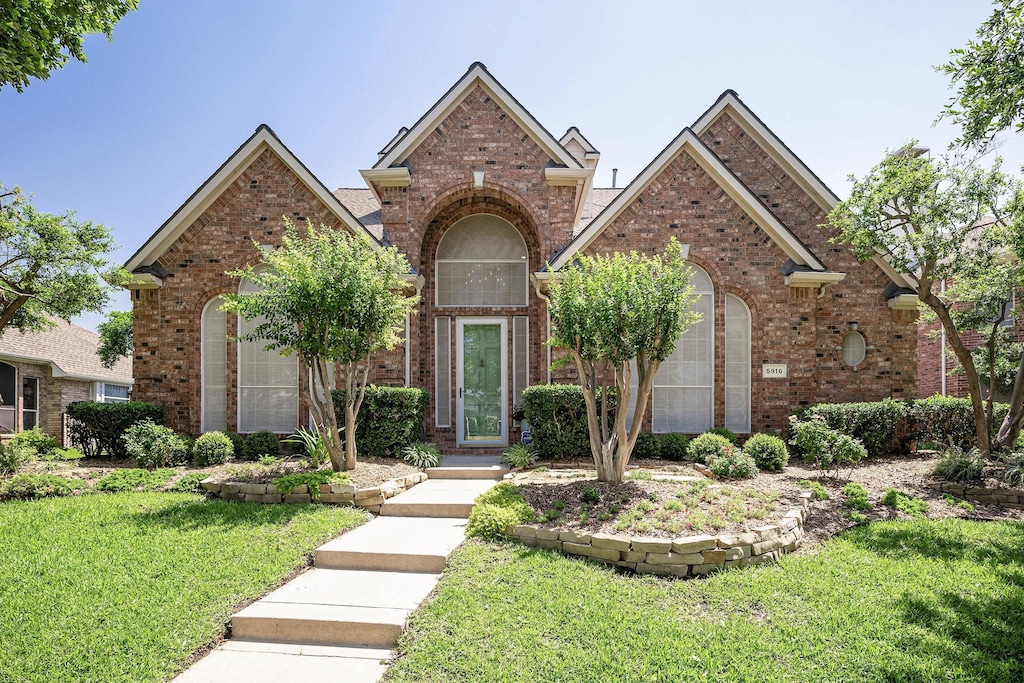 front facade with a front yard