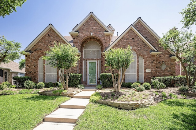 front facade with a front yard