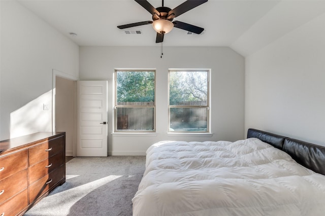 carpeted bedroom featuring ceiling fan and lofted ceiling