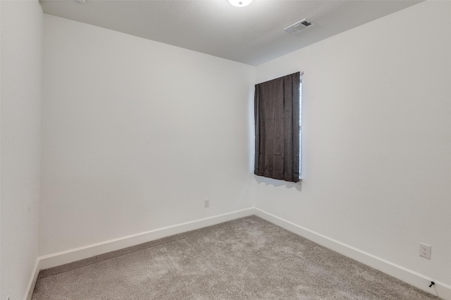 empty room with light colored carpet