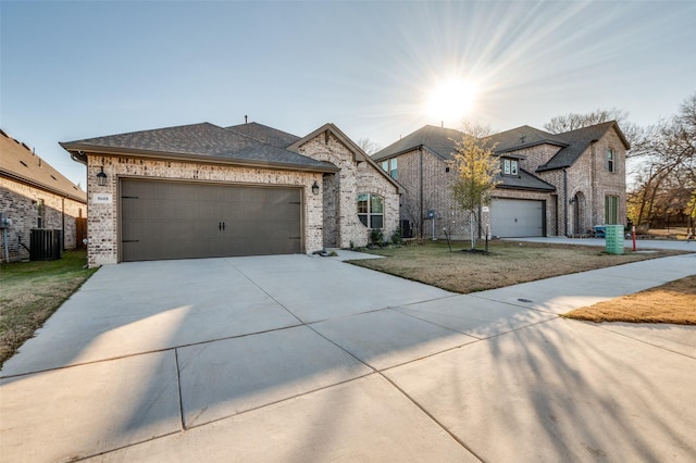 view of front of home featuring central AC and a front yard