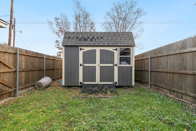 view of outbuilding with a lawn