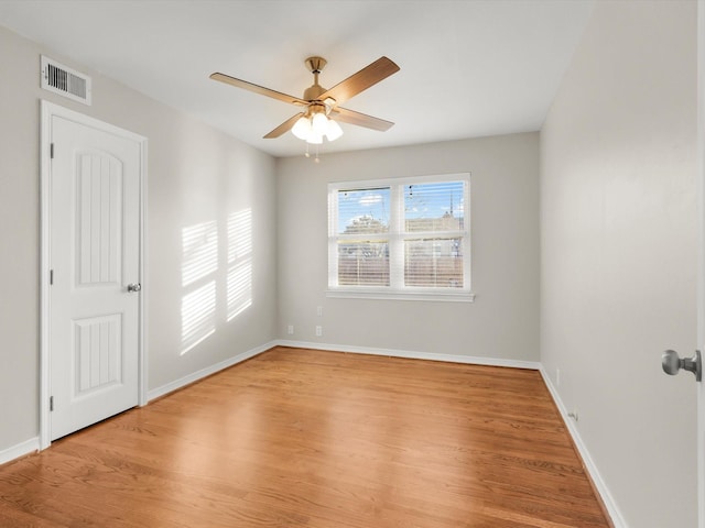 spare room featuring ceiling fan and light hardwood / wood-style floors