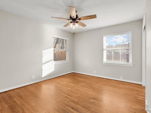 spare room featuring ceiling fan and light hardwood / wood-style flooring