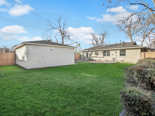 back of property featuring a yard and a patio