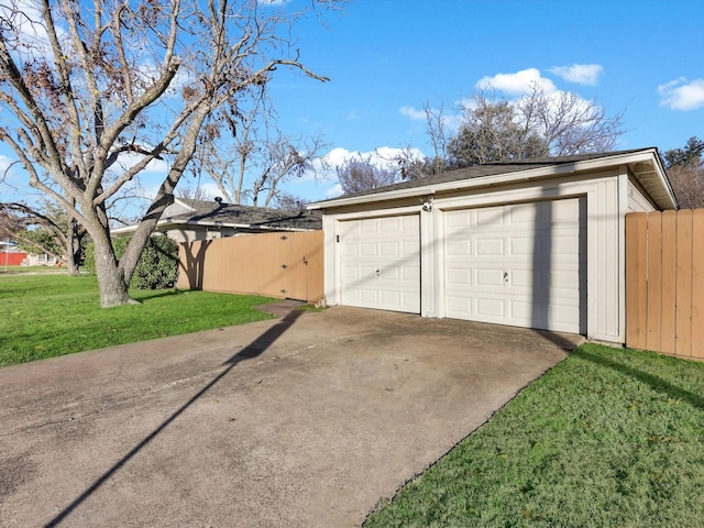 garage featuring a lawn