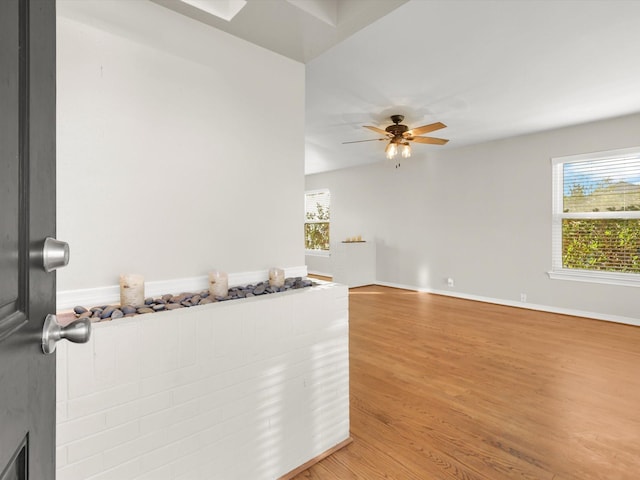 interior space featuring hardwood / wood-style floors and ceiling fan