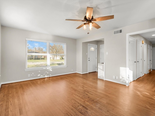 unfurnished room with wood-type flooring and ceiling fan